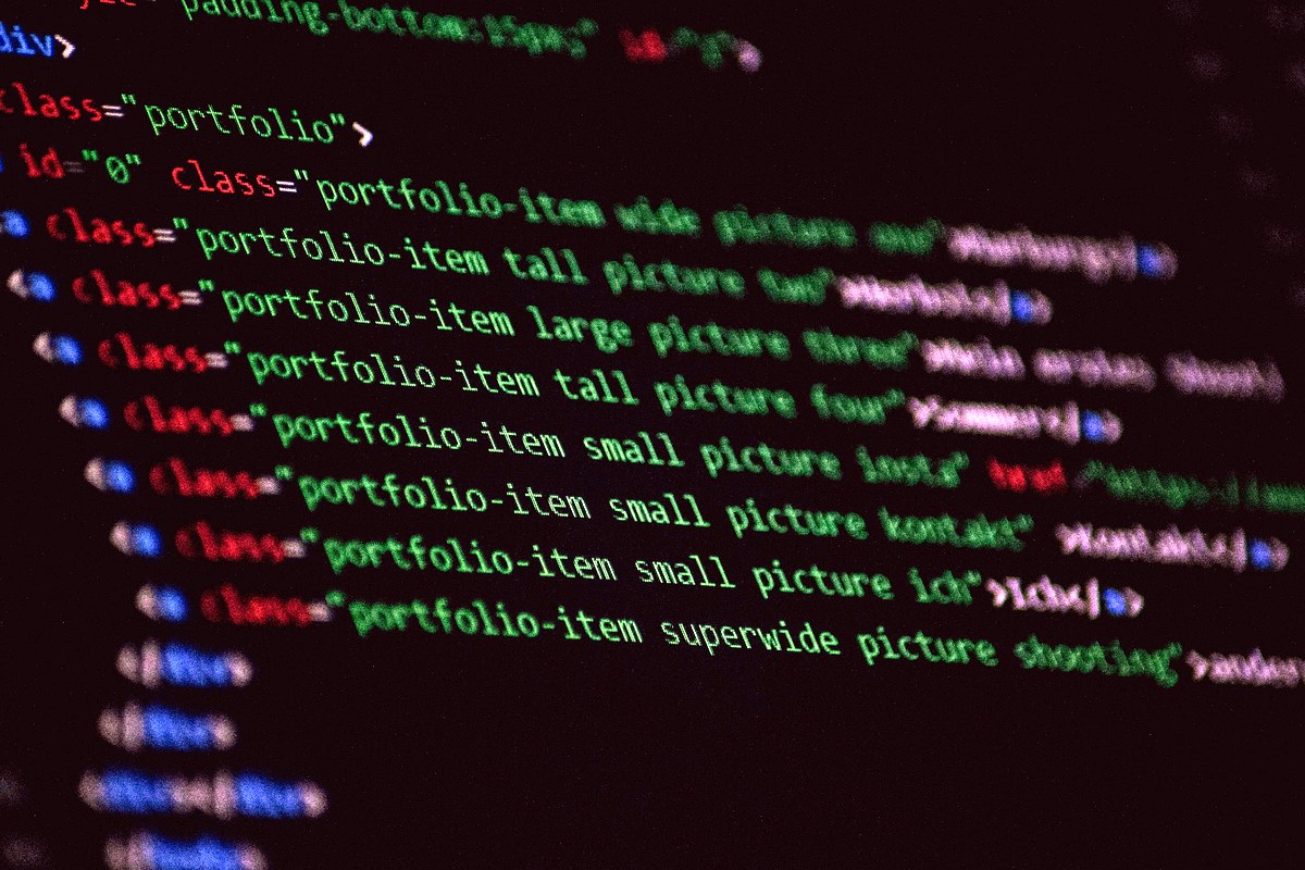 Close-up of colorful website code on a dark screen
